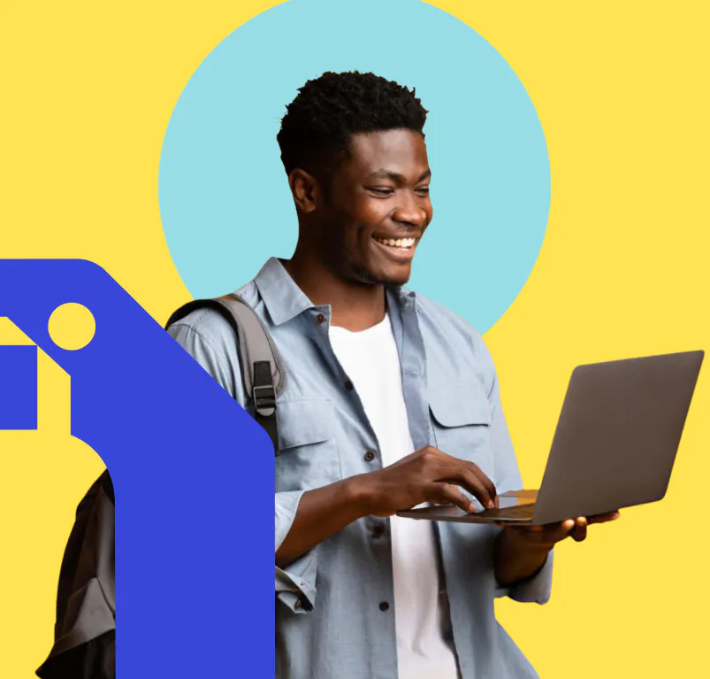 Student smiling with a laptop
